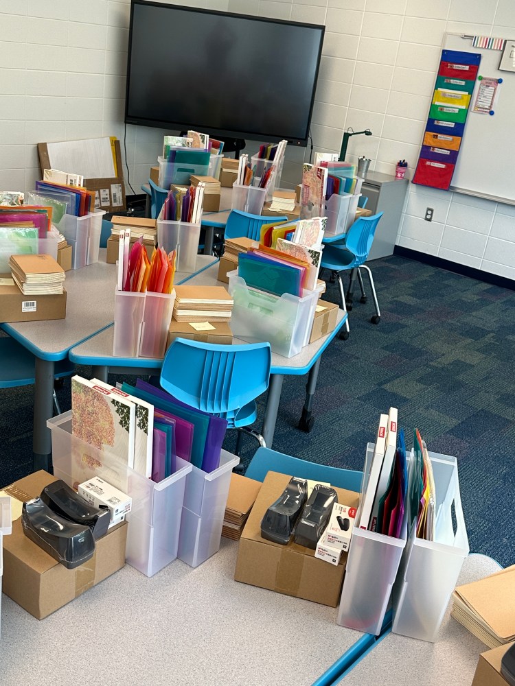 Writing kits set out on tables