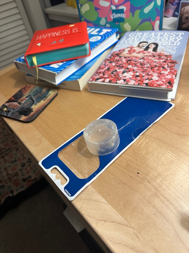 Picture of an upside down cap on top of a nightstand