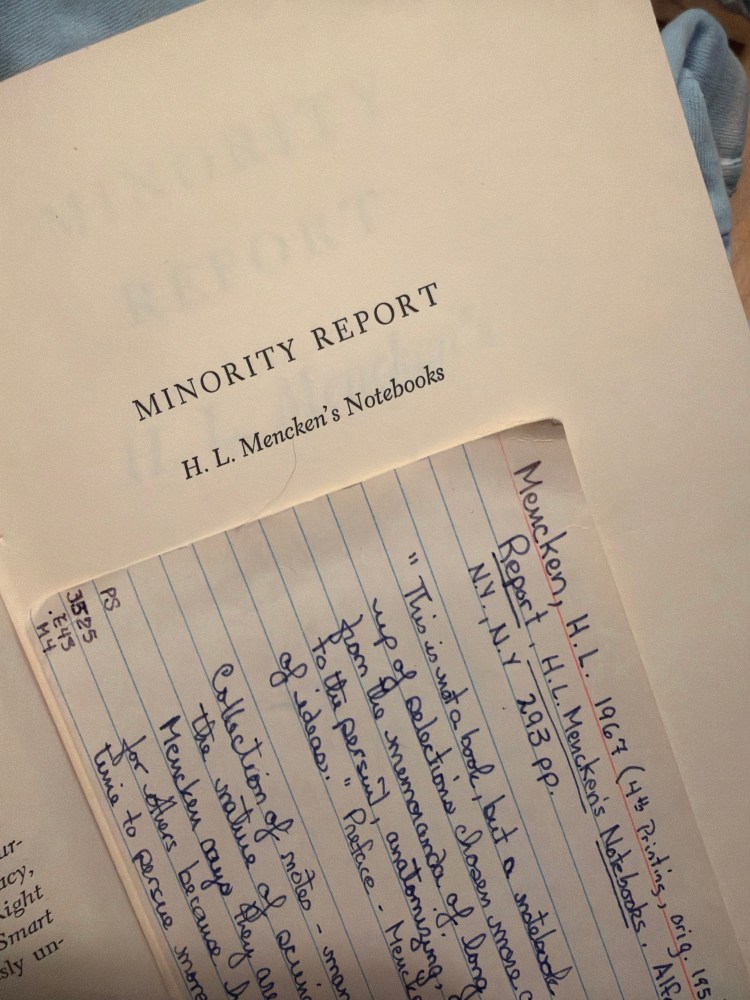Picture of the book "Minority Report," with a numbered note card