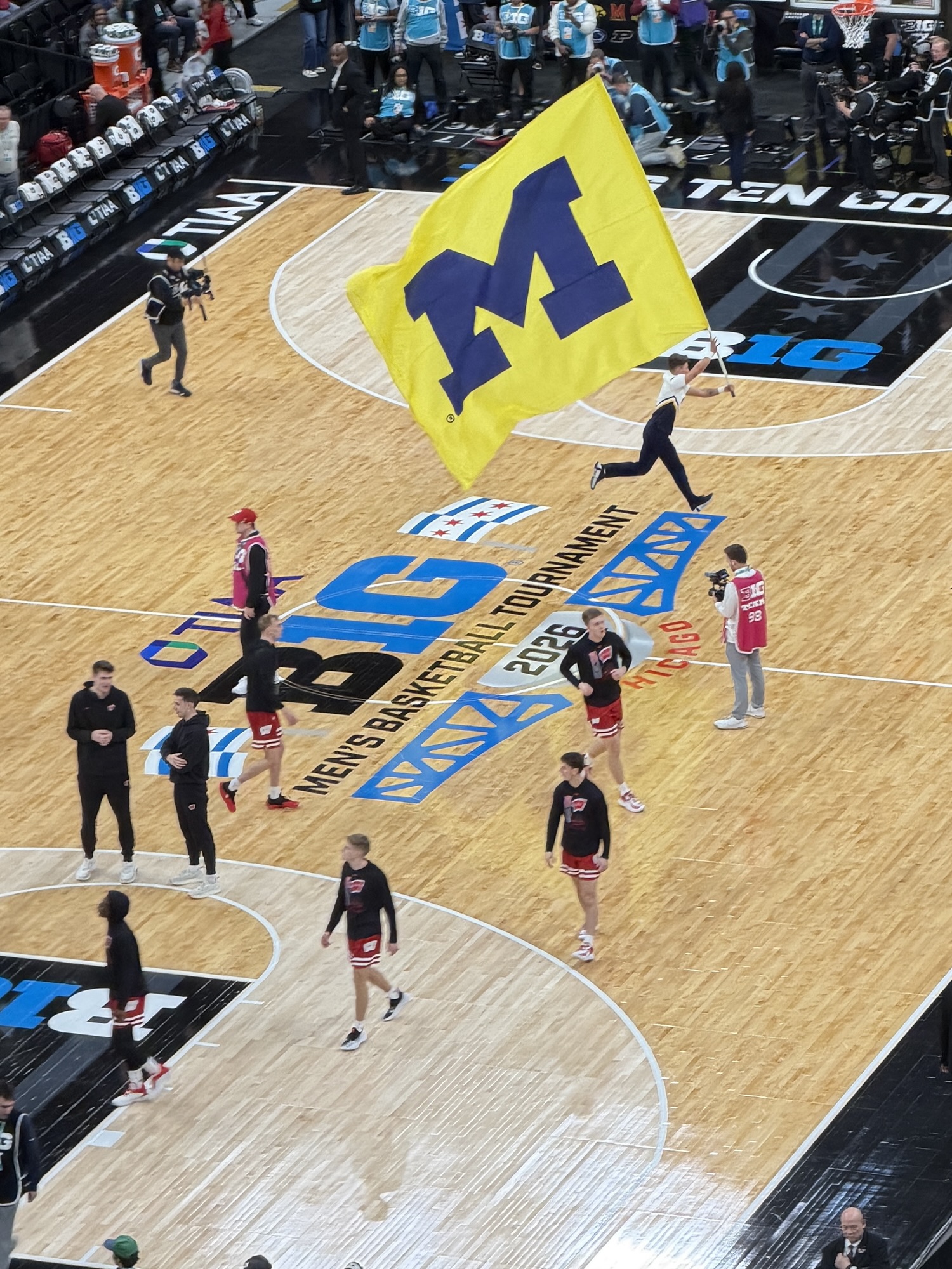 Picture of Michigan basketball players with flags